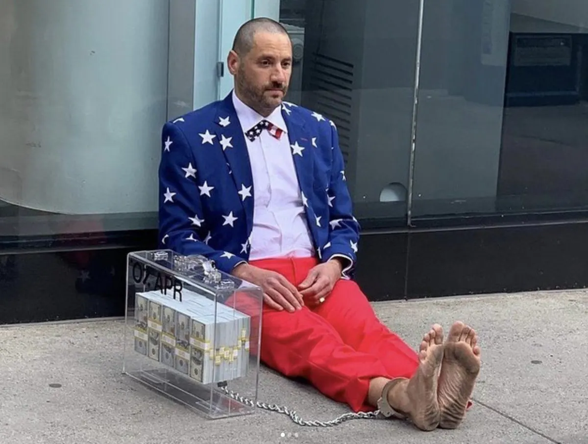 Capitalist Man — handcuffed to the 0% APR case